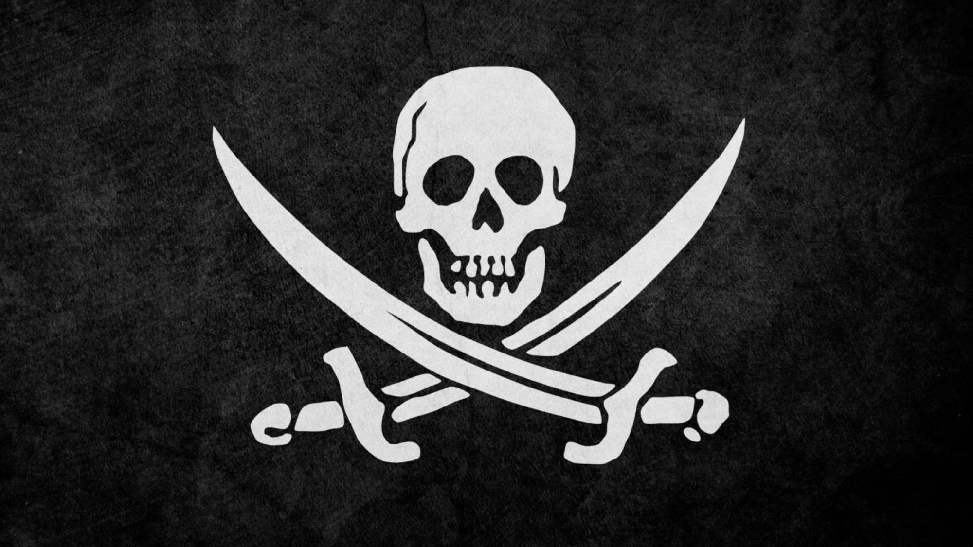 bateau pirate avec voiles noires, godille et os croisés et drapeau